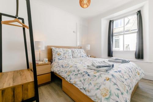 a small bedroom with a bed and a window at 1 Bed in Looe oc-l30038 in Looe