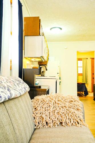 a room with a bed and a living room at Elevated Ski Chalet at Powderhorn Mountain in Bessemer