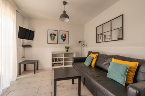 a living room with a couch and a table at The Energy Apartment in Caleta De Fuste