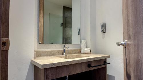 a bathroom with a sink and a mirror at Casa Solsticio 212 in Cholula