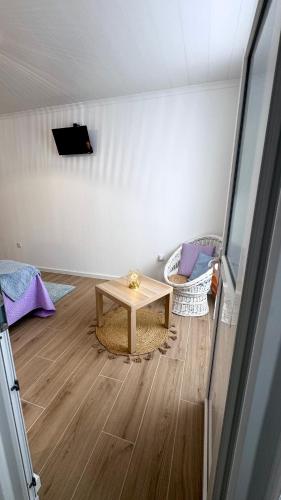 a room with a table in the middle of a room at Raiz Atlântica in Angra do Heroísmo