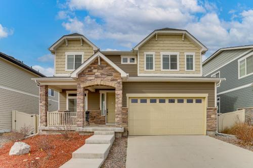a house with a garage at 17 Mi to Downtown Denver Modern Aurora Home! in Aurora