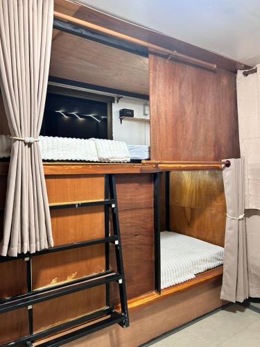 a couple of bunk beds in a room at Blueka Hostel Ko Chang in Khlaung Phai Bae
