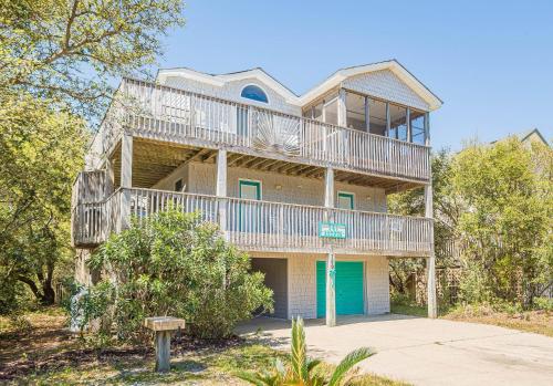 a large house with balconies on the side of it at Beach Place - Corolla, Ocean Sands, 370 Yards to the Beach, Flex Stays, Pets OK, Pool! in Corolla