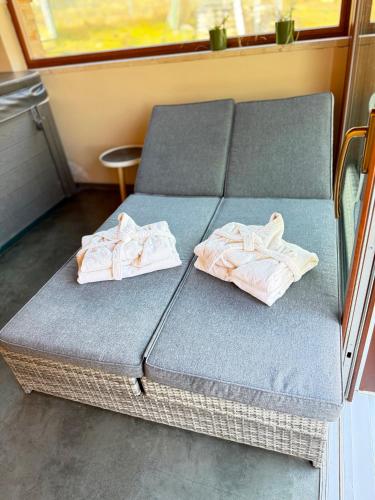 a bed in a room with towels on it at U Pěti kohoutů in Liberec