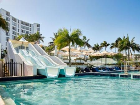 a swimming pool with a slide in a resort at Breakers Resort Apartment 314 in Durban