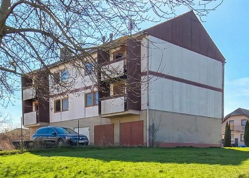 a building with a car parked in front of it at Kechnec - Seňa in Kehnec