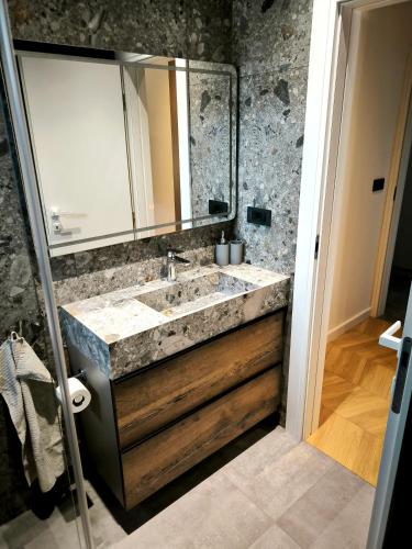 a bathroom with a sink and a mirror at Artistik in Vodice
