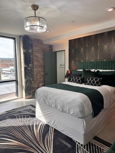 a bedroom with a large bed and a large window at Gilded Skyline, Walk Everywhere, 7th-Floor Views in Chattanooga