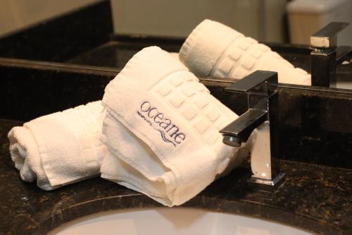 a toilet paper roll sitting on top of a sink at Oceane Norte Hotel in Parnaíba