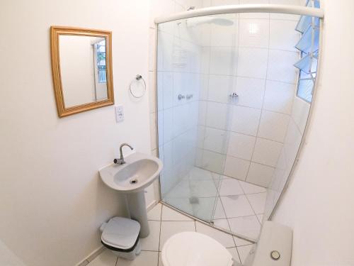 a bathroom with a shower and a sink at Che Lagarto Paraty in Paraty
