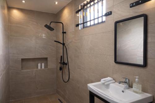 a bathroom with a shower and a sink at D'eaU BleU Villa-Private pool in Pereybere