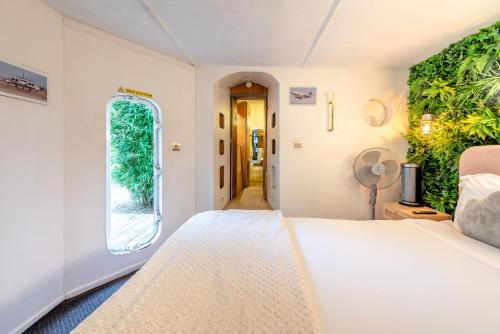 a bedroom with a white bed and a window at 1 Bed in Redberth oc-s33669 in Redberth