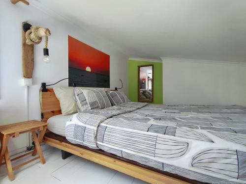 a bedroom with a large bed and a table at Quinta Da vida Serena in Gaio