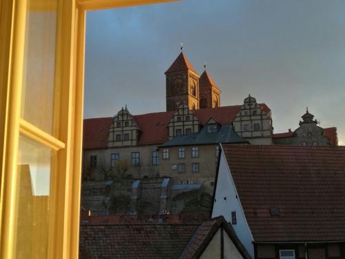 a view of a building with a clock tower at Ferienwohnungen Finkenherd 5 in Quedlinburg