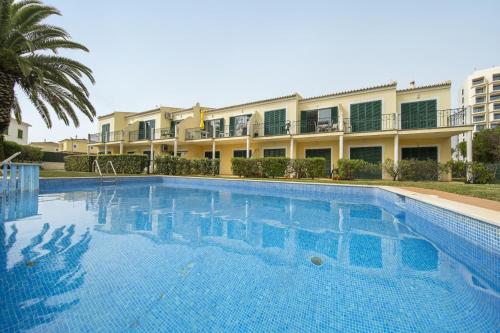 a large swimming pool in front of a building at B76 - Piedade Apartment in Lagos in Lagos