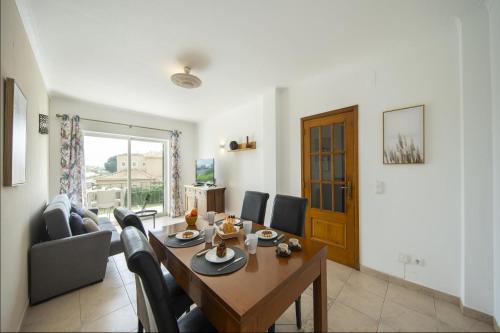 a living room with a table and a couch at B76 - Piedade Apartment in Lagos in Lagos