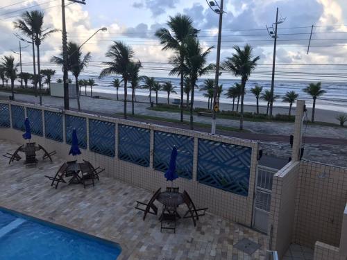 a view of the beach from the balcony of a resort at Pousada dos Eletricitarios in Praia Grande