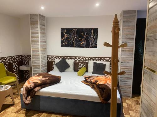 a bedroom with a bed and a cross on the wall at Shaheen hotel in Suez