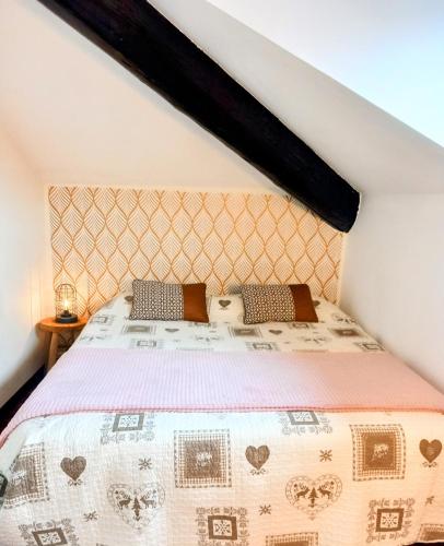 a bedroom with a bed in a attic at Mansarda in centro Menaggio con spiaggia privata e possibilità garage in Menaggio
