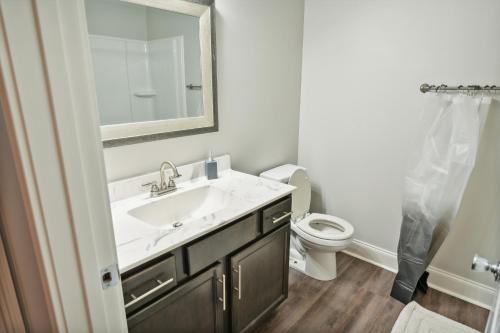 a bathroom with a sink and a toilet at Properties by Preston I 2Bd2bth Townhome in Clarksville