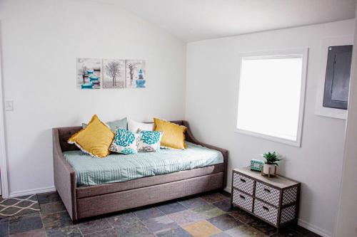 a couch sitting in a room with a window at Westport Whitehouse in Westport