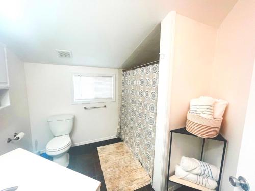 a bathroom with a toilet and a window at Westport Whitehouse in Westport