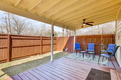 a screened porch with blue chairs and a ceiling fan at Pet-Friendly Canyon Lake Studio Fish, Boat, Relax in Canyon Lake