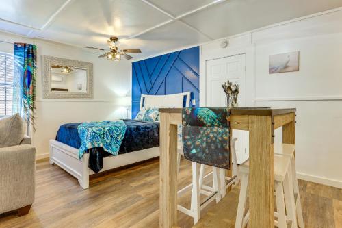 a bedroom with a bed and a desk at Pet-Friendly Canyon Lake Studio Fish, Boat, Relax in Canyon Lake