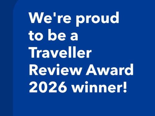a blue text saying were proud to be a traveller review award winner at Karma Chic&Style Intera Villa in Korçë