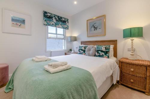 a bedroom with a bed with two towels on it at 2 Bed in Penzance oc-u34133 in Penzance