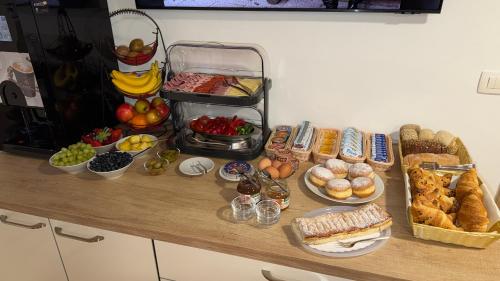 a table with many different types of food on it at Domačija Log v Bohinju in Bohinjska Bistrica