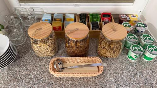 a group of jars of food sitting on a counter at Domačija Log v Bohinju in Bohinjska Bistrica