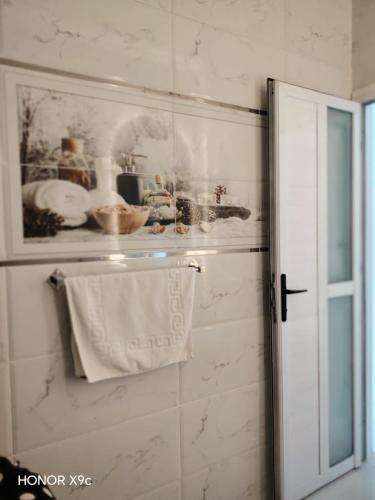 a bathroom with a towel hanging on a wall at SunShine in Quseir