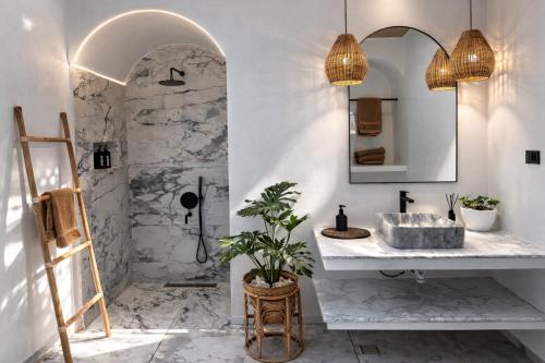 a bathroom with a sink and a mirror at Pineale Villas, Resort and Spa in Panglao Island