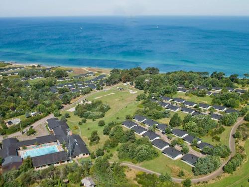 an aerial view of a resort near the ocean at 6 person holiday home in Gilleleje in Gilleleje