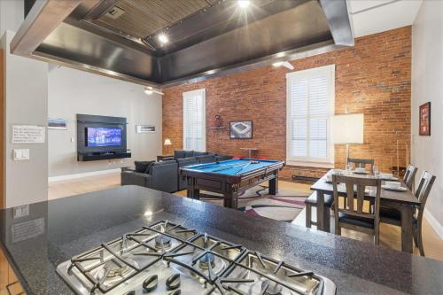 a living room with a ping pong table at 1800 Sq Ft Loft Downtown Near Convention Center in Indianapolis