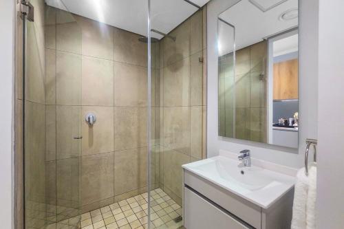 a bathroom with a sink and a shower at Solitude Studio Apartment, Ellipse, Midrand in Midrand