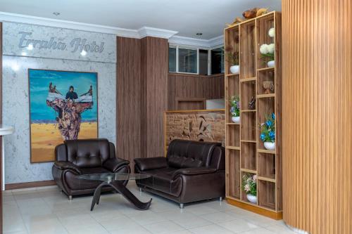 a waiting room with two chairs and a table at Erraha Hostel Dakhla in Dakhla