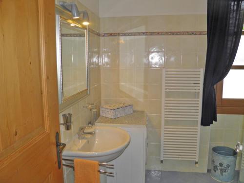 a bathroom with a sink and a mirror at Barolo in Gravedona