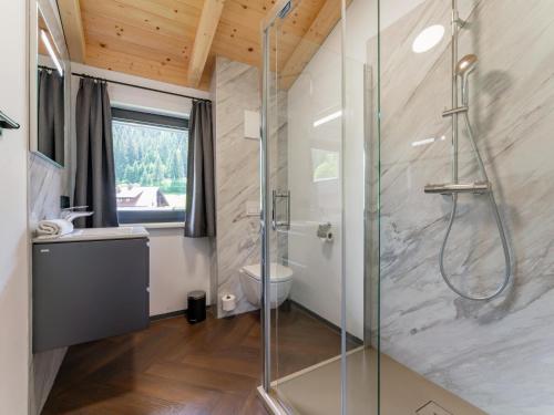 a bathroom with a shower and a glass shower stall at Obermöschach 10 in Obermöschach
