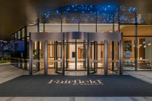 a building with a sign that reads fiji fidelity by paramount at Fairfield by Marriott Deqing in Huzhou