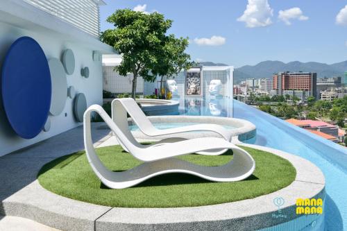 a rendering of a white lounge chair on a roof at Stallionz by Mana Mana in Ipoh