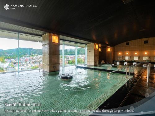 a large pool of water in a building at KAMENOI HOTEL Ome in Ome