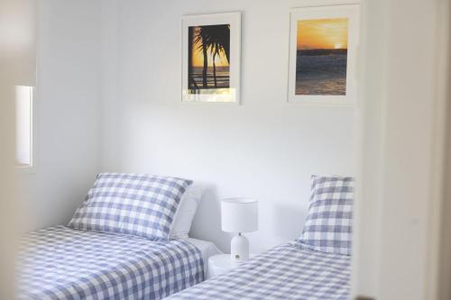 two beds sitting next to each other in a bedroom at 3-45 Beech Street in Evans Head