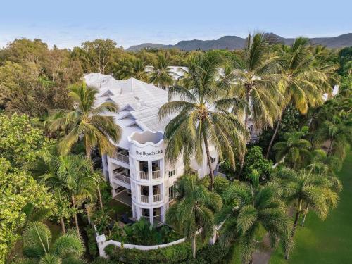 an aerial view of a resort with palm trees at Peppers Beach Club in Port Douglas