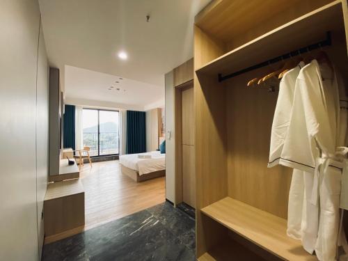 a hotel room with a bedroom and a bed at Fan's Hotel Palo in Tacloban