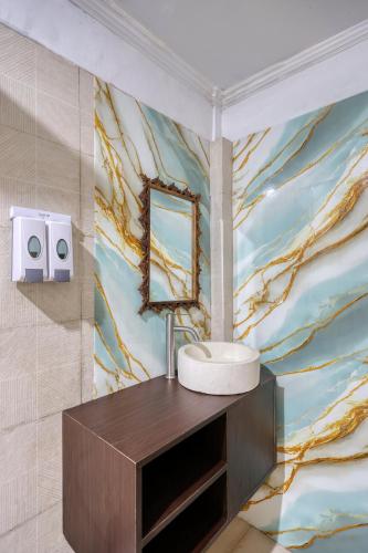 a bathroom with a sink and a mirror at Kelingking Point in Nusa Penida