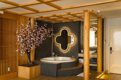 a bathroom with a jigsaw sign and a bath tub at Cupid Hotel 3 in Ho Chi Minh City