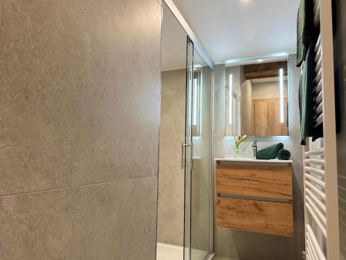a bathroom with a shower and a sink at Leogang apartment with mountain views in Leogang